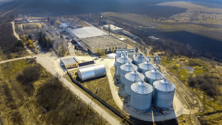 Aerial Drone View Winery Metal Cisterns With Bare Trees Fields Around It Moldova 1268 17445
