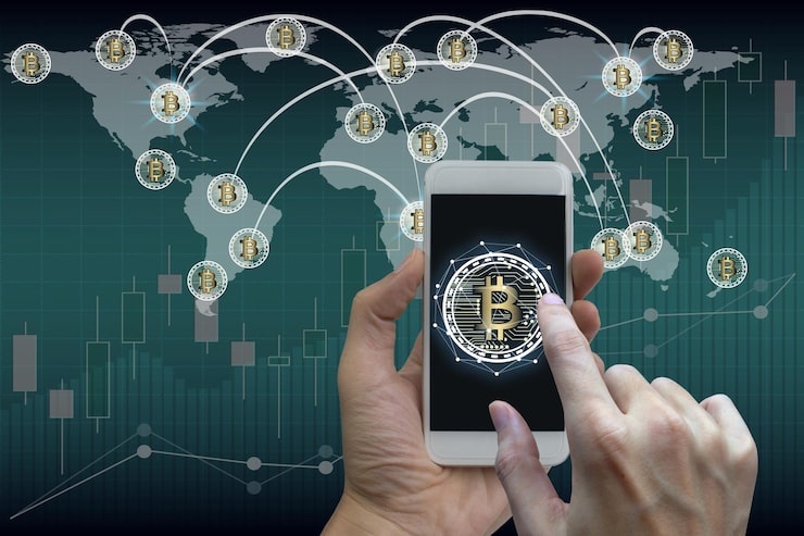 Close Up Hand Using Mobile Phone With Bitcoin Symbol Against World Map 40362 217